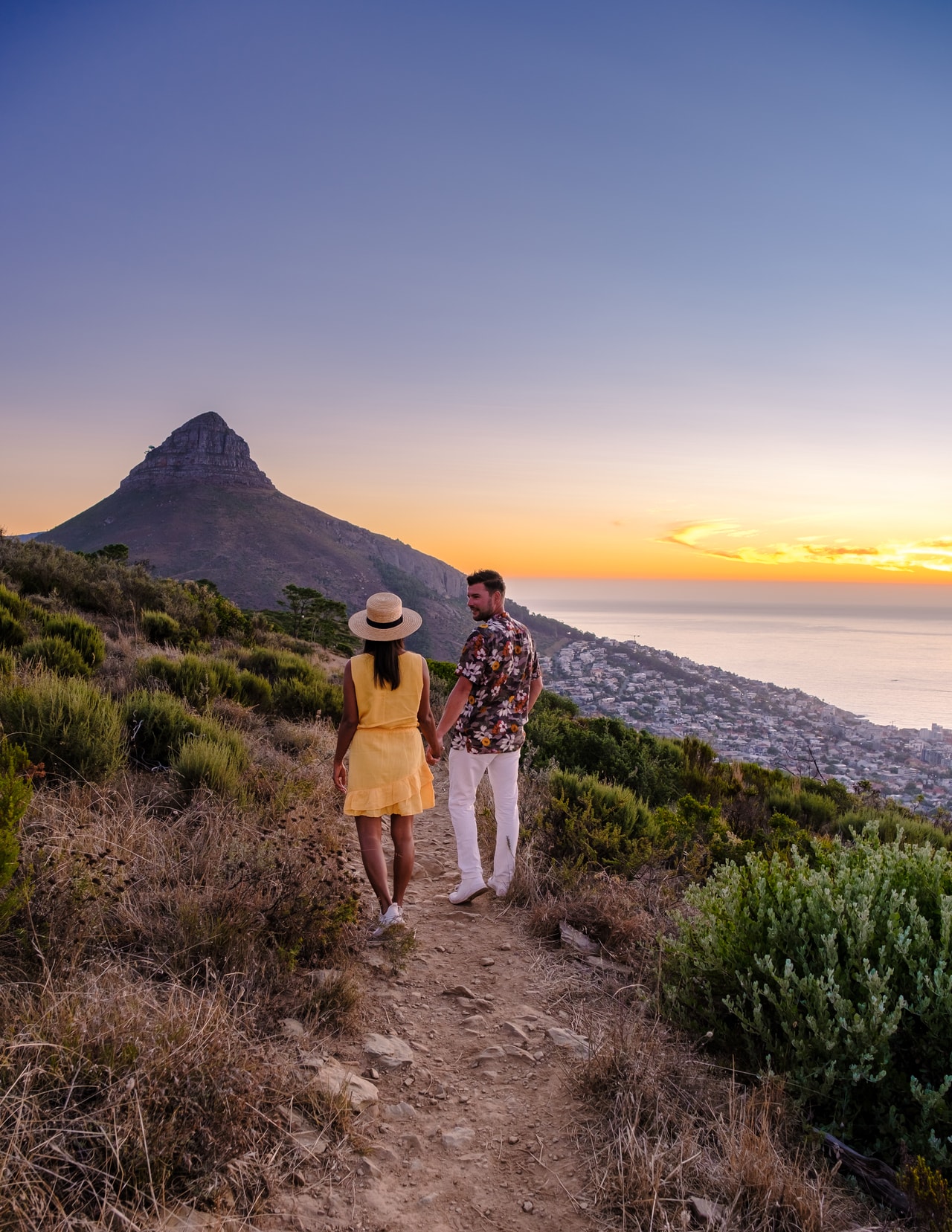 a-couple-of-men-and-women-watching-the-sunset