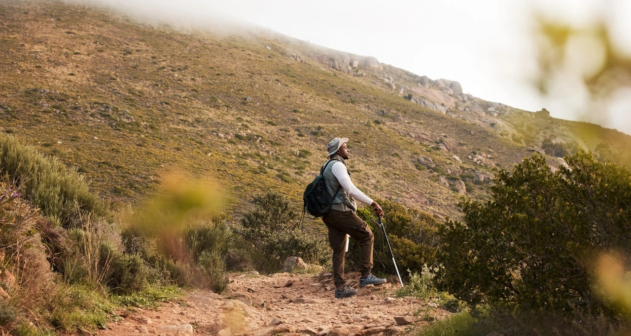 hiking-thinking-or-black-man-on-mountain-in-natur